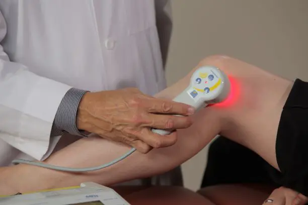 photobiomodulation therapy to the knee